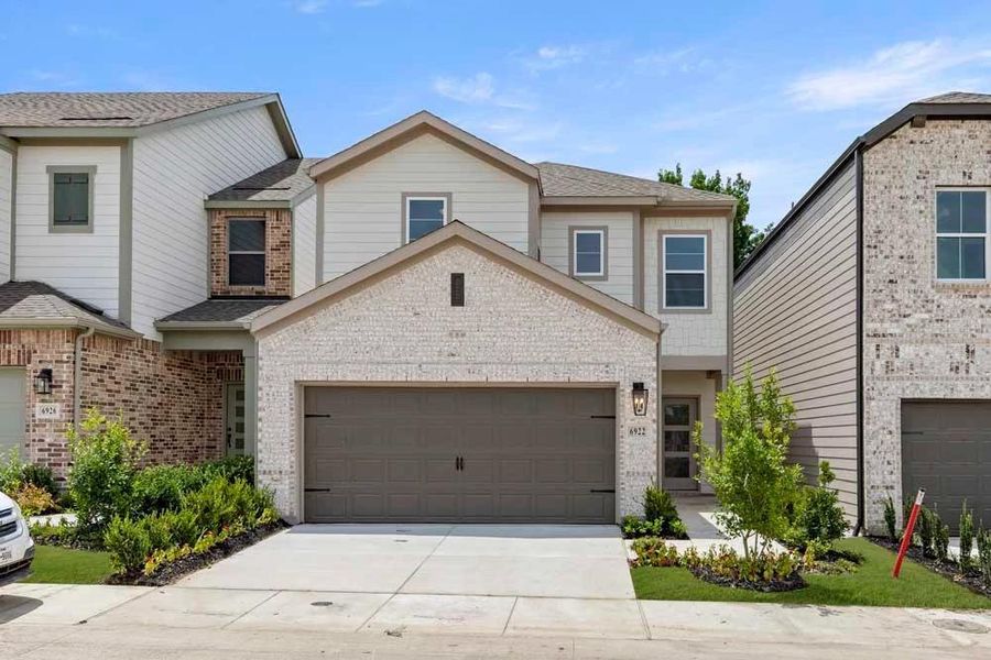 Front exterior of a new home in Sereno Oaks at Buckner Terrace, Dallas, TX, highlighting curb appeal (Image 2). Front exterior of a new home in Sereno Oaks at Buckner Terrace, Dallas, TX, highlighting curb appeal (Image 2).