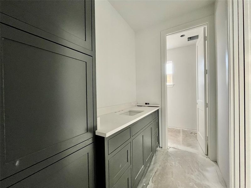 Bathroom featuring concrete flooring and vanity