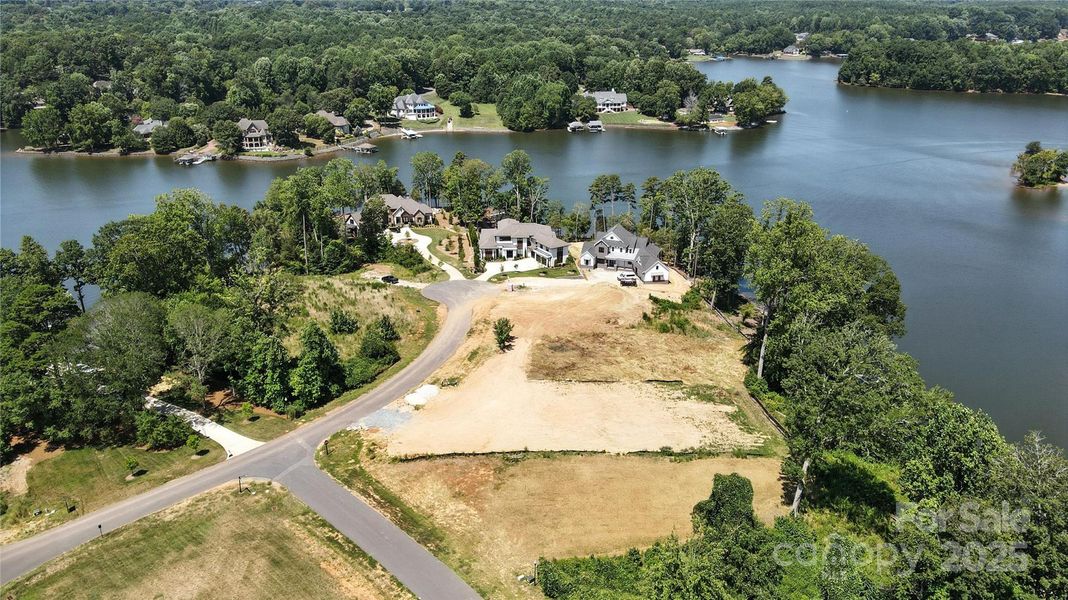 Tucked into a peaceful cove on Lake Wylie, this property offers the perfect blend of natural beauty and year-round recreation—swimming, fishing, and easy access to open water for boating and water sports
