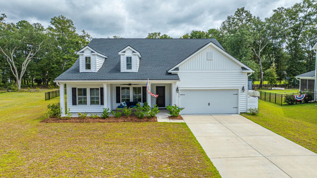 Front exterior of a new home in Saint John's Lake: Coastal Collection, Johns Island, SC, highlighting curb appeal (Image 22).