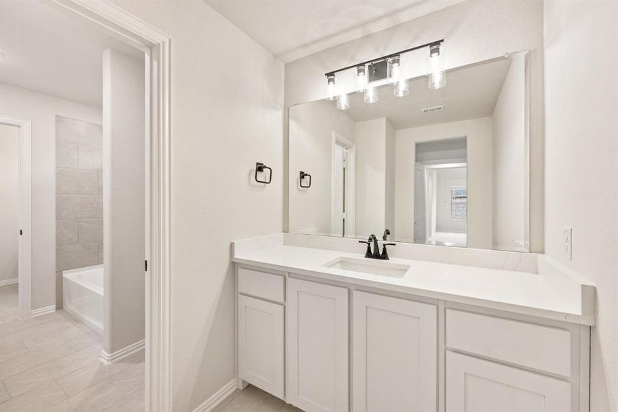 Furnished interior view inside a new home in Villages of Hurricane Creek, Anna (Image 11).