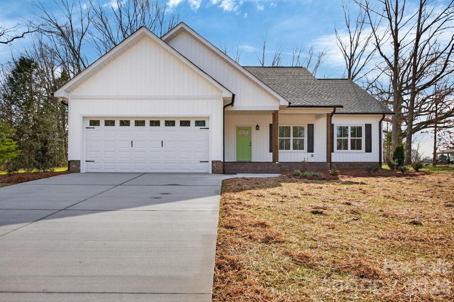 Front exterior of a new home in , Rockwell, NC, highlighting curb appeal (Image 24).