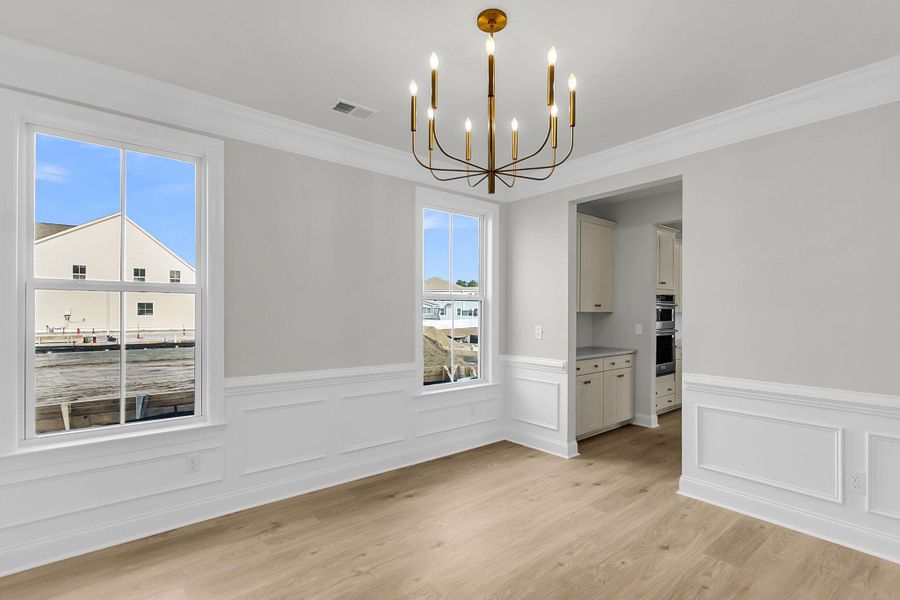 Spacious, unfurnished interior of a new home in Tidewater at Lakes of Cane Bay, Summerville (Image 35).