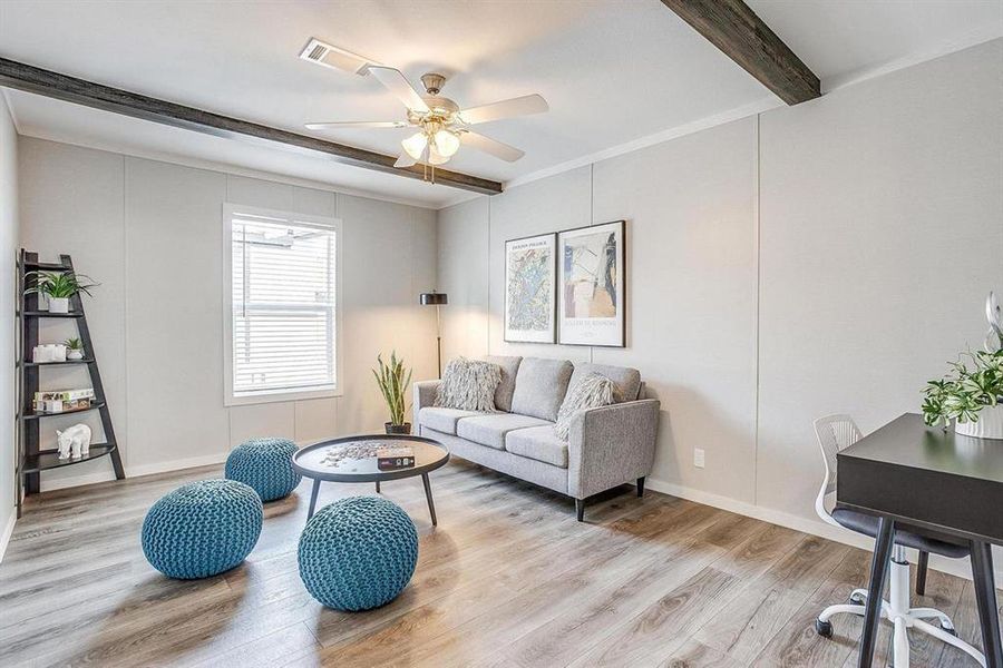 Living room featuring beamed ceiling, light wood-type flooring, and ceiling fan