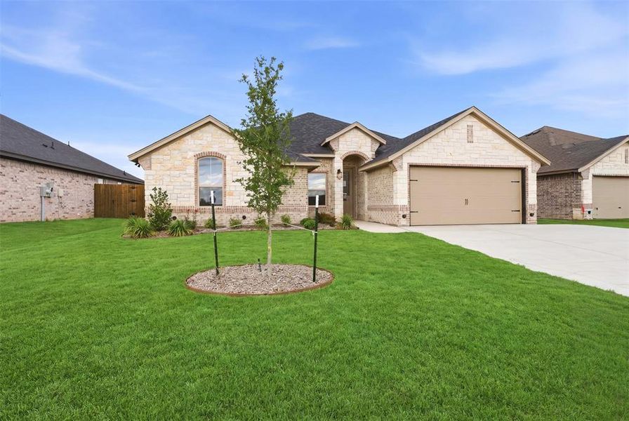 Front exterior of a new home in , Tolar, TX, highlighting curb appeal (Image 20).