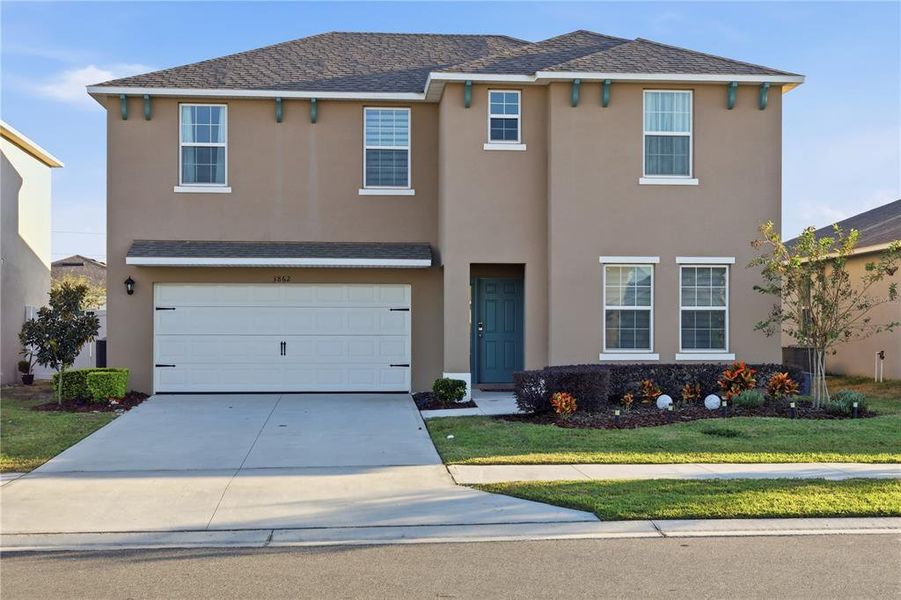 Front exterior of a new home in Wind Meadows South, Bartow, FL, highlighting curb appeal (Image 1).