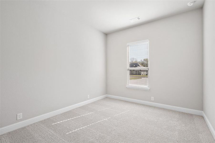 Unfurnished room with light colored carpet