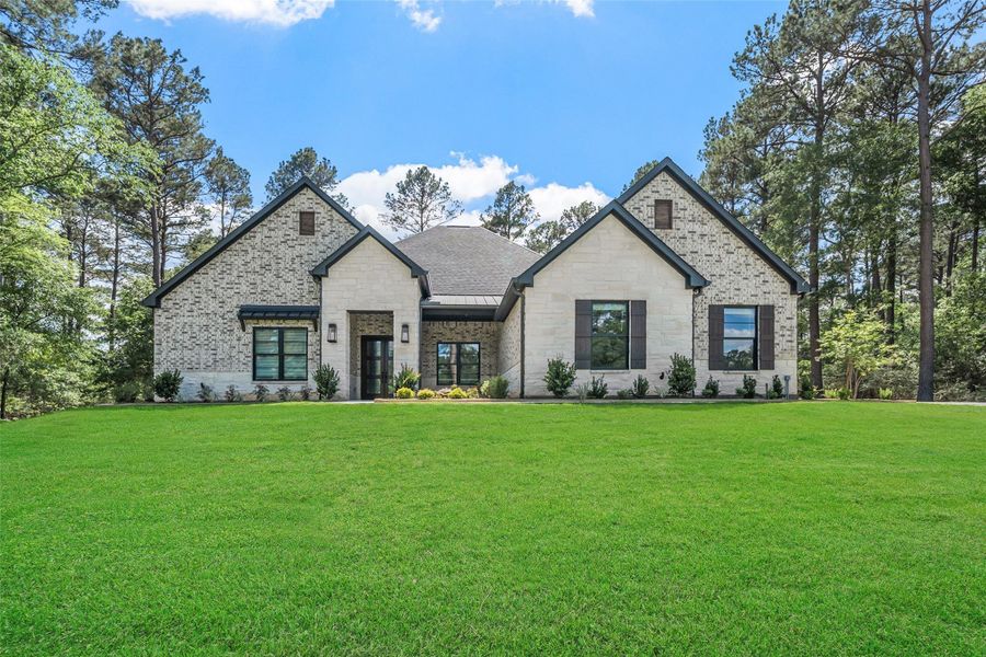 Front exterior of a new home in , Plantersville, TX, highlighting curb appeal (Image 26). Front exterior of a new home in , Plantersville, TX, highlighting curb appeal (Image 26).