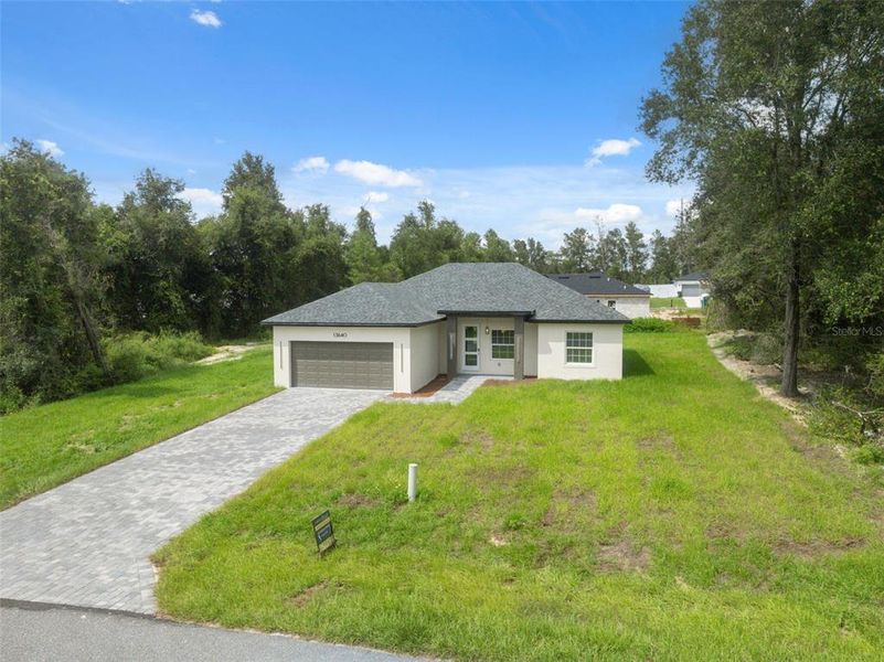 Front exterior of a new home in , Ocala, FL, highlighting curb appeal (Image 16).