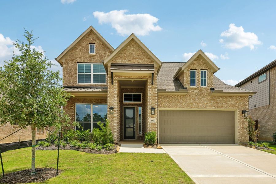 Front exterior of a new home in The Trails 50's, New Caney, TX, highlighting curb appeal (Image 2). Front exterior of a new home in The Trails 50's, New Caney, TX, highlighting curb appeal (Image 2).