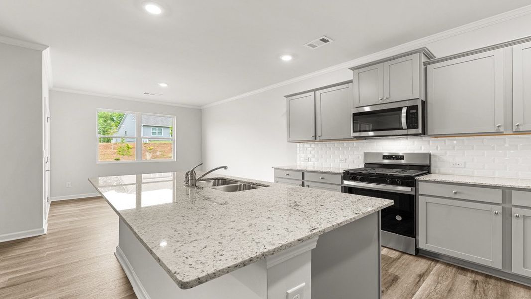 Representative furnished interior of a home built from the Booth by D.R. Horton in Liberty Crossing, Braselton (Image 7).