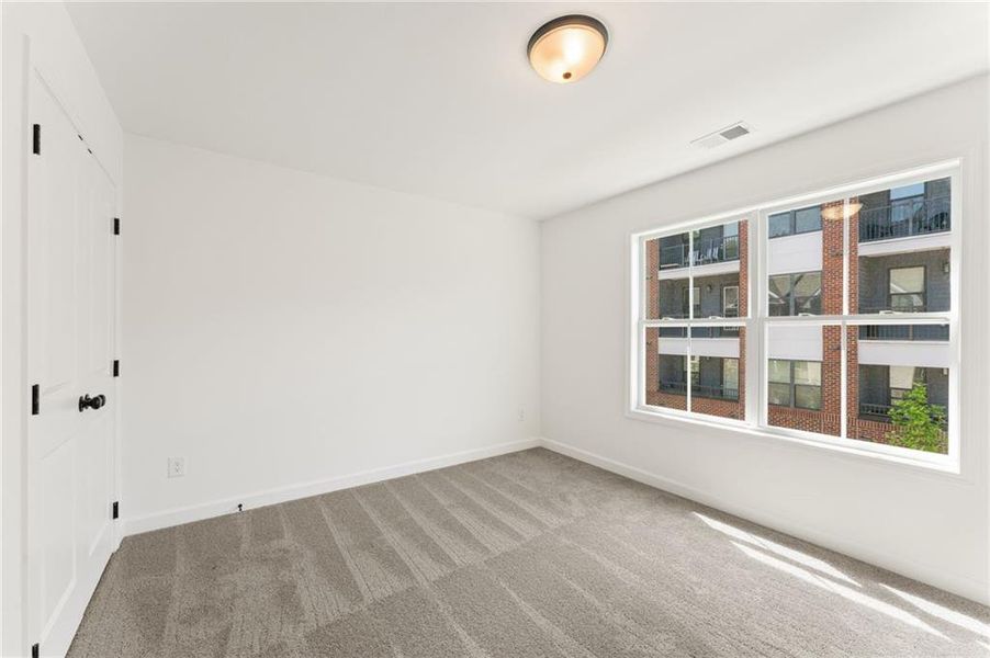 Spacious, unfurnished interior of a new home in Townes at South Main, Kennesaw (Image 23).