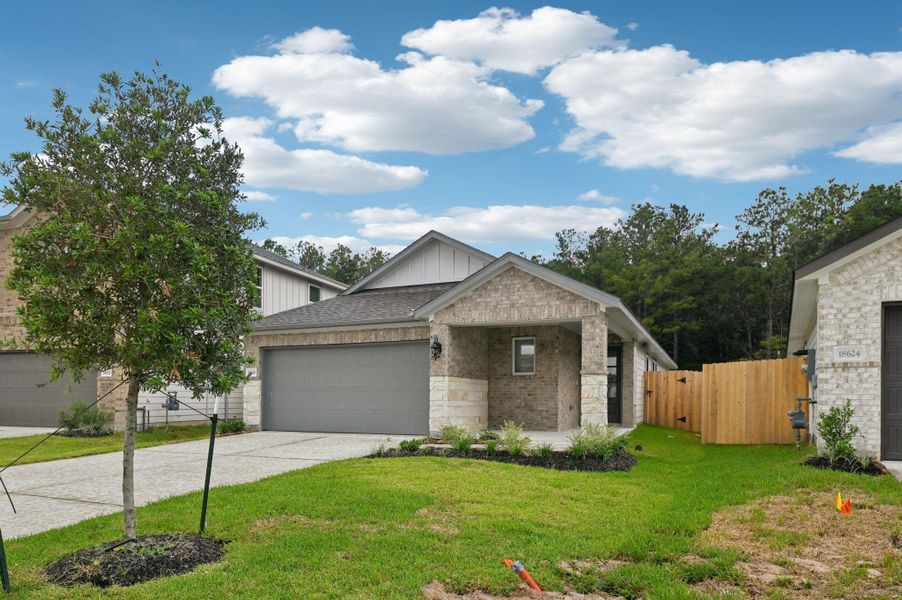 Front exterior of a new home in Landing Meadows - Traditional Series, New Caney, TX, highlighting curb appeal (Image 20).
