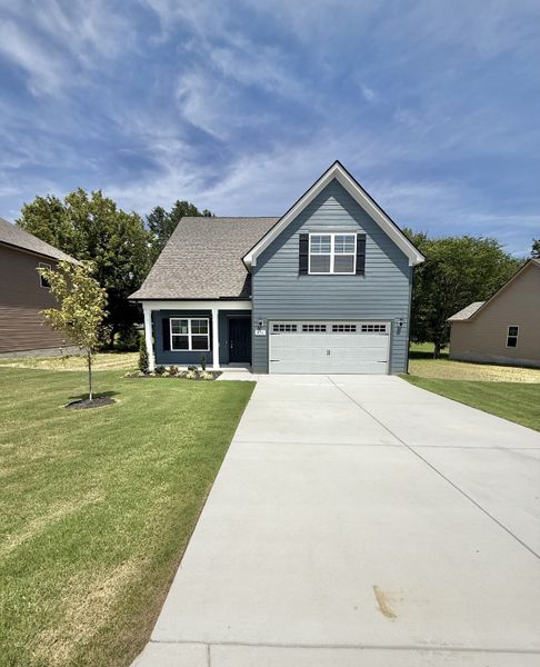 Front exterior of a new home in Stone Fort Meadows, Manchester, TN, highlighting curb appeal (Image 1). Front exterior of a new home in Stone Fort Meadows, Manchester, TN, highlighting curb appeal (Image 1).