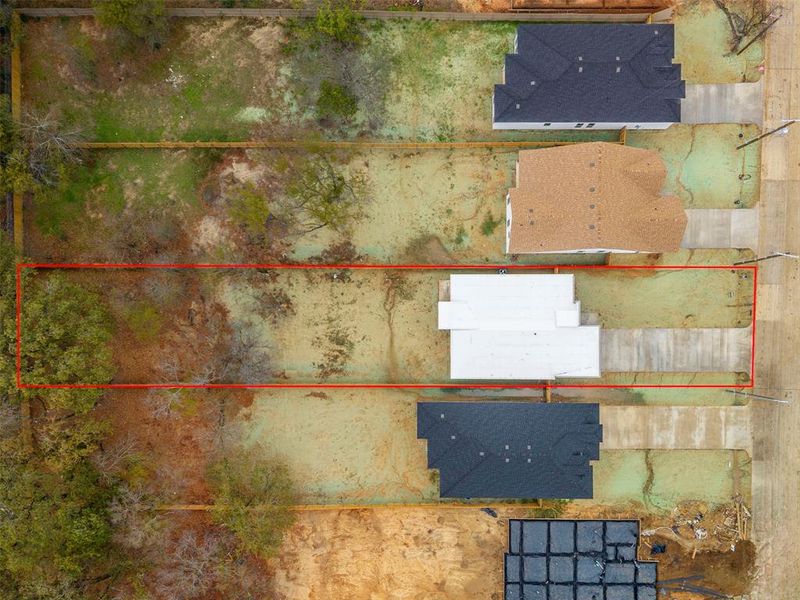 Aerial view of property and surrounding area featuring property boundaries highlighted