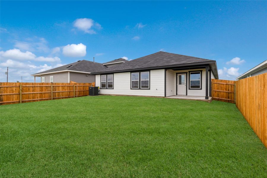 Front exterior of a new home in Monarch Ranch, Manor, TX, highlighting curb appeal (Image 2). Front exterior of a new home in Monarch Ranch, Manor, TX, highlighting curb appeal (Image 2).