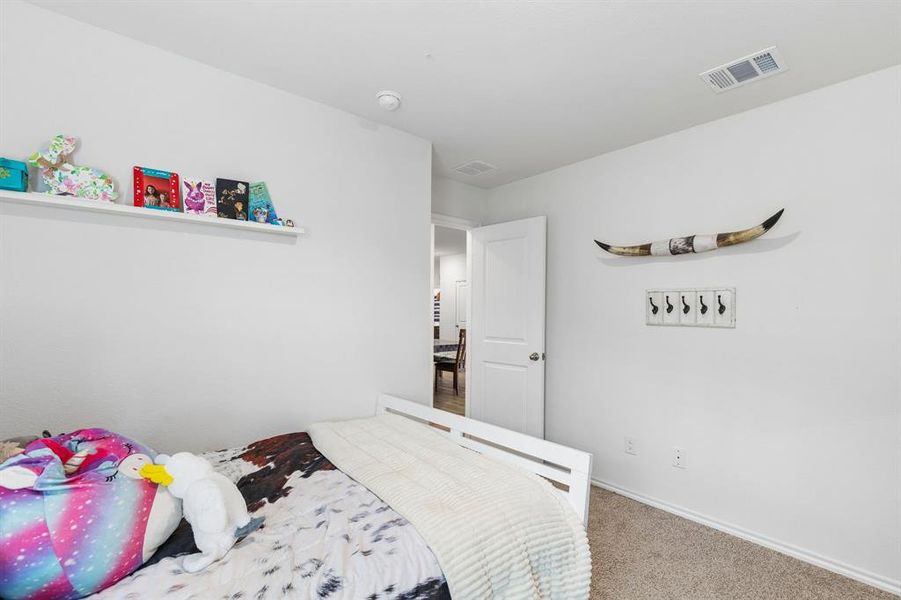 Bedroom with carpet and baseboards Bedroom with carpet and baseboards