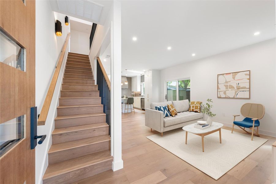Hardwood floors flow through the living space, creating an inviting, open atmosphere perfect for everyday living. Hardwood floors flow through the living space, creating an inviting, open atmosphere perfect for everyday living.