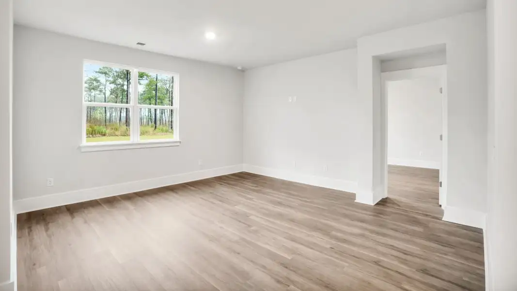 Representative unfurnished interior of a home built from the Claiborne by D.R. Horton in The Highlands at Cedar Hill Landing, Navassa (Image 16).