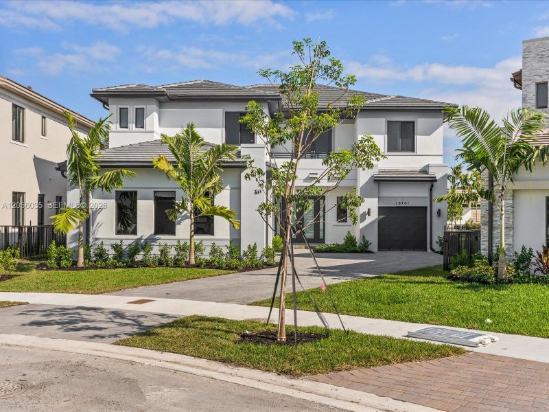 Front exterior of a new home in , Miami, FL, highlighting curb appeal (Image 1). Front exterior of a new home in , Miami, FL, highlighting curb appeal (Image 1).
