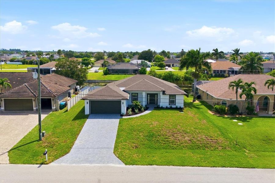 Front exterior of a new home in , Cape Coral, FL, highlighting curb appeal (Image 26).