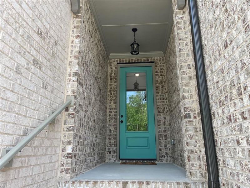 Exterior details and patio area of a home in The Collection at Wolf Creek, Lawrenceville (Image 4).