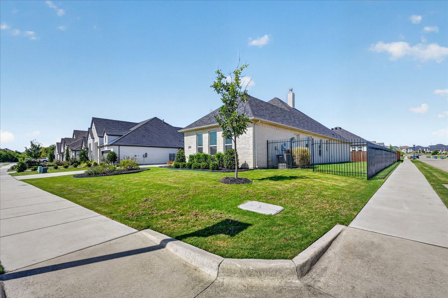 Front exterior of a new home in LeTara, Haslet, TX, highlighting curb appeal (Image 19).