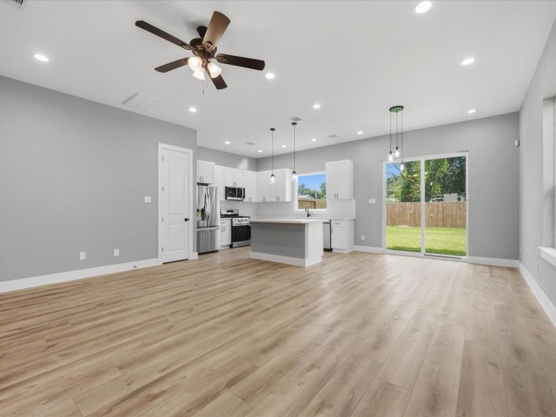 Thoughtfully designed for modern living, the open-concept floor plan encourages connection between the living, dining, and kitchen spaces. Thoughtfully designed for modern living, the open-concept floor plan encourages connection between the living, dining, and kitchen spaces.