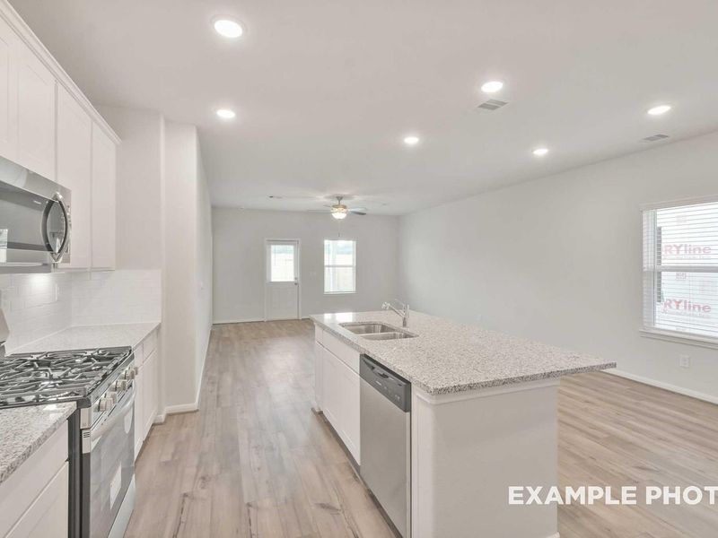 Furnished interior view inside a new home in Caney Creek Place, Conroe (Image 5).