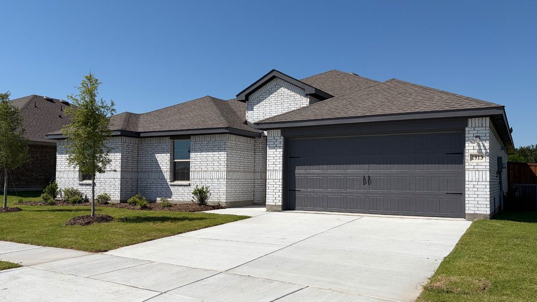 Front exterior of a new home in Northspur, Terrell, TX, highlighting curb appeal (Image 1). Front exterior of a new home in Northspur, Terrell, TX, highlighting curb appeal (Image 1).