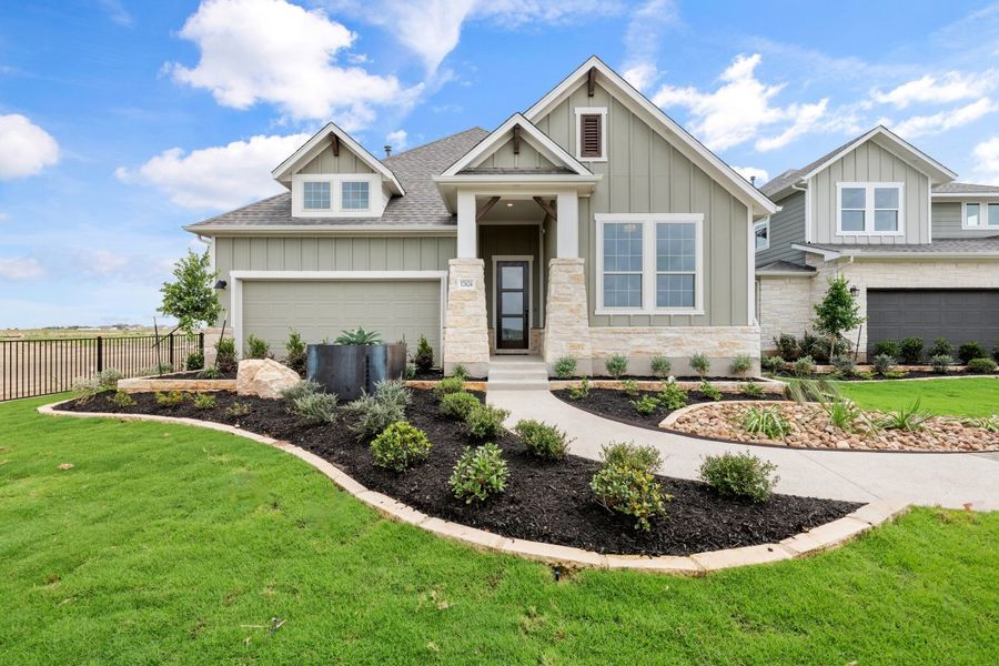 Representative exterior photo of a completed home built from the Sawgrass by Ashton Woods in Lagos Reserve, Manor, TX (Image 20). Representative exterior photo of a completed home built from the Sawgrass by Ashton Woods in Lagos Reserve, Manor, TX (Image 20).