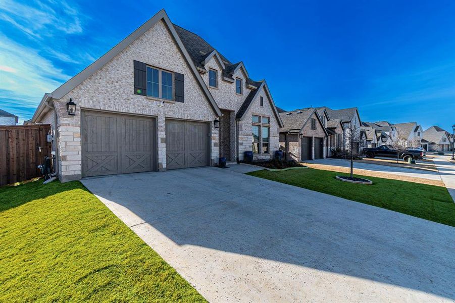 Front exterior of a new home in Sweetgrass, Haslet, TX, highlighting curb appeal (Image 2). Front exterior of a new home in Sweetgrass, Haslet, TX, highlighting curb appeal (Image 2).