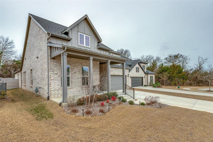 Front exterior of a new home in Painted Tree - South, McKinney, TX, highlighting curb appeal (Image 21).