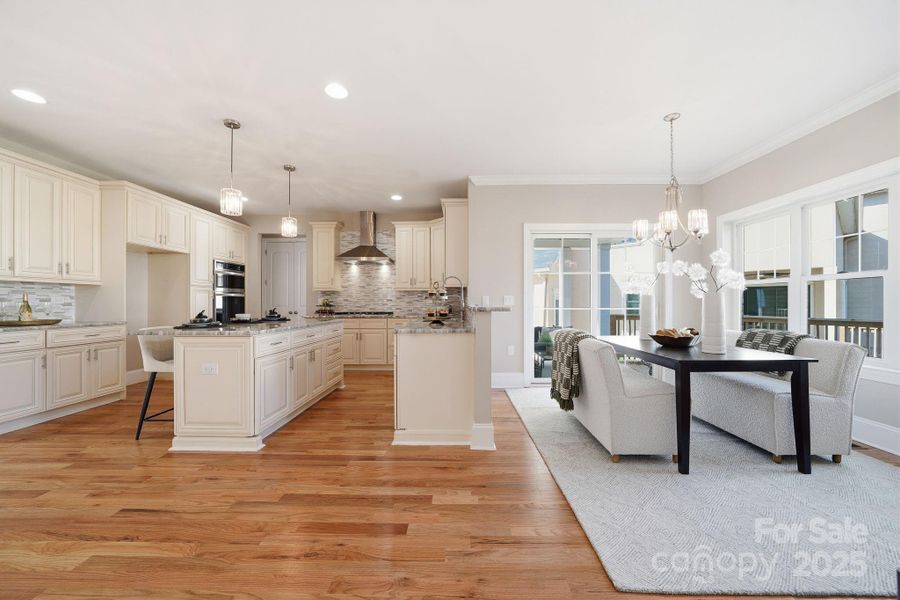 Expansive kitchen and breakfast area with seamless flow into the living room — perfect for gatherings. Expansive kitchen and breakfast area with seamless flow into the living room — perfect for gatherings.