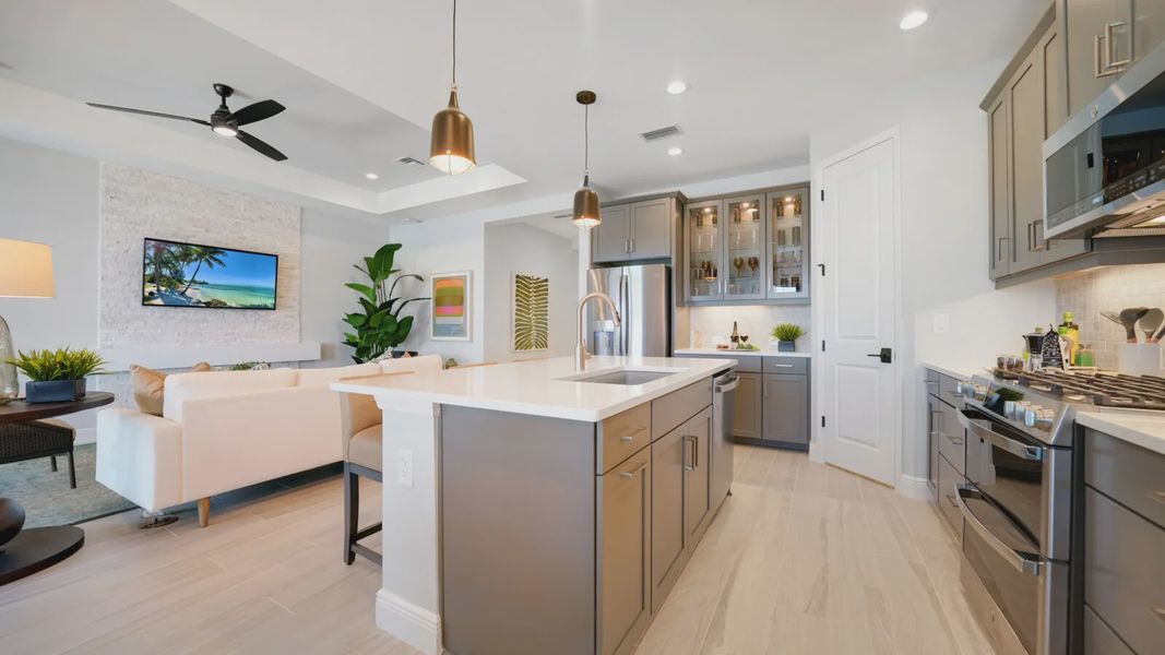Representative furnished interior of a home built from the Meadow Brook by Neal Communities in SkySail, Naples (Image 11).