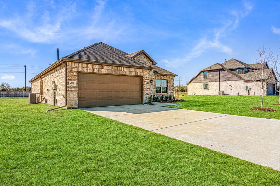Front exterior of a new home in Mallard Point, Greenville, TX, highlighting curb appeal (Image 16). Front exterior of a new home in Mallard Point, Greenville, TX, highlighting curb appeal (Image 16).