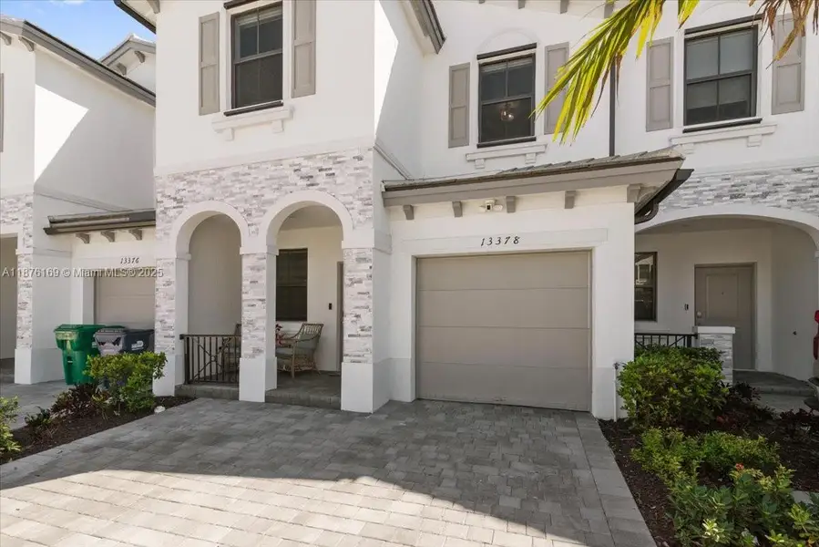 Front exterior of a new home in , Homestead, FL, highlighting curb appeal (Image 1).