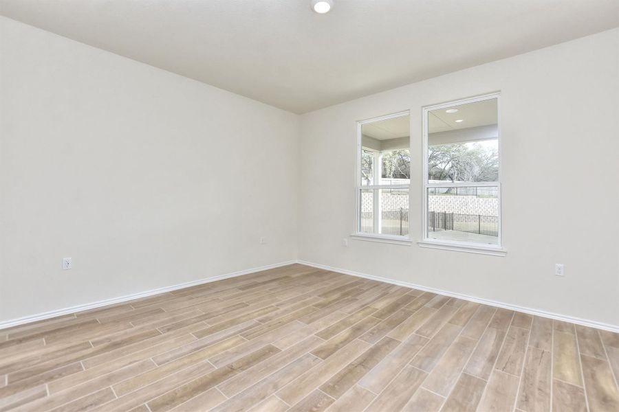 Primary room with recessed lighting, baseboards, and light wood-type flooring