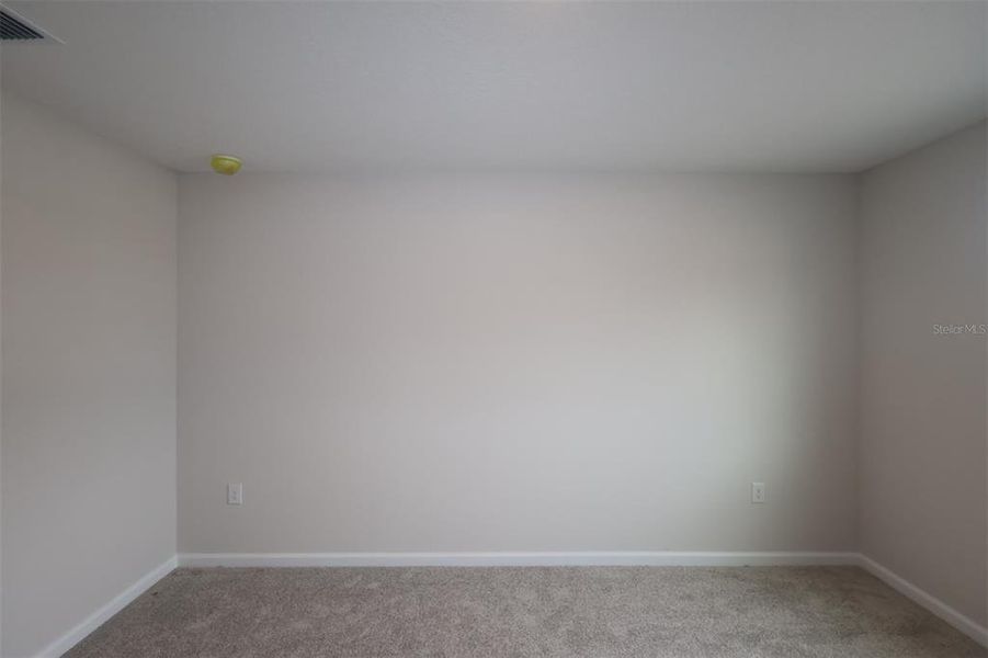 Spacious, unfurnished interior of a new home in Reeves Place, Orlando (Image 11).