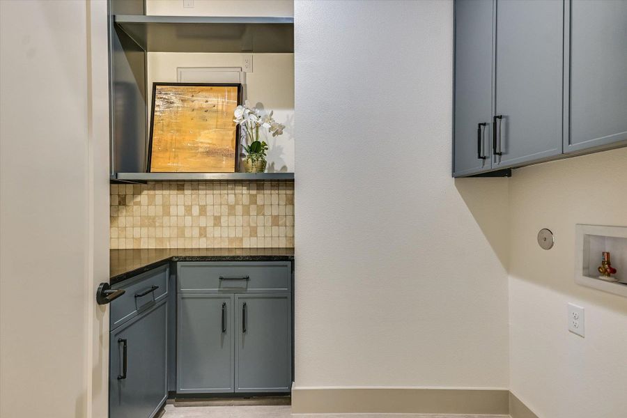 Large laundry room with ample storage and folding space! Large laundry room with ample storage and folding space!