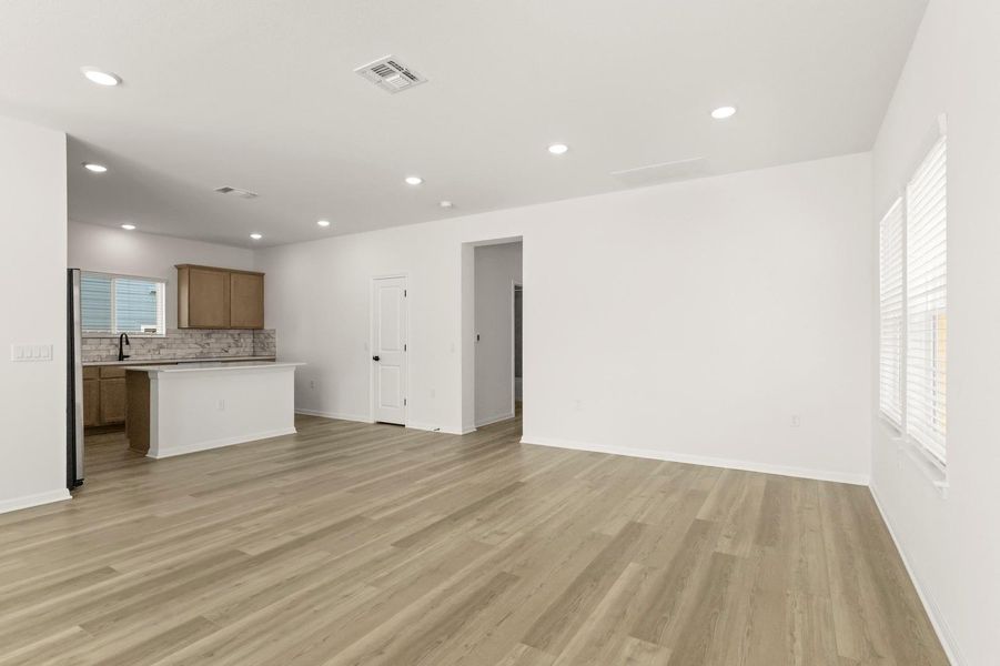 Unfurnished living room featuring recessed lighting and light wood-type flooring
