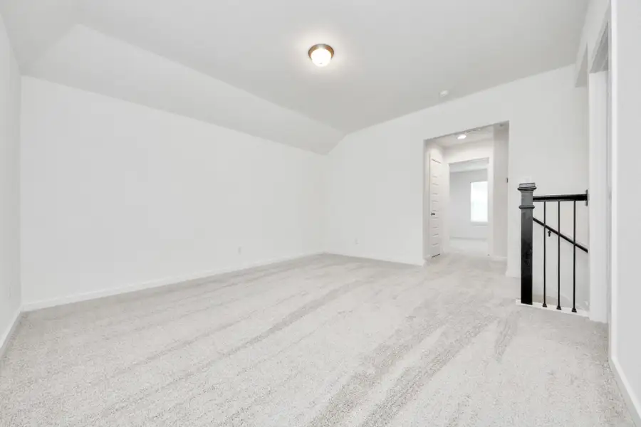 Ascend to relaxation in this fantastic game room! Ideal for both casual gatherings and adult gaming, it boasts plush carpet, lofty ceilings, custom paint, and ample windows for abundant natural light.