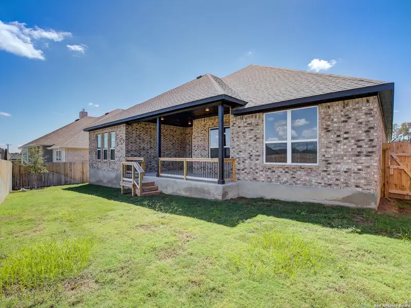 Exterior details and patio area of a home in The Reserve at Potranco Oaks, Castroville (Image 3).