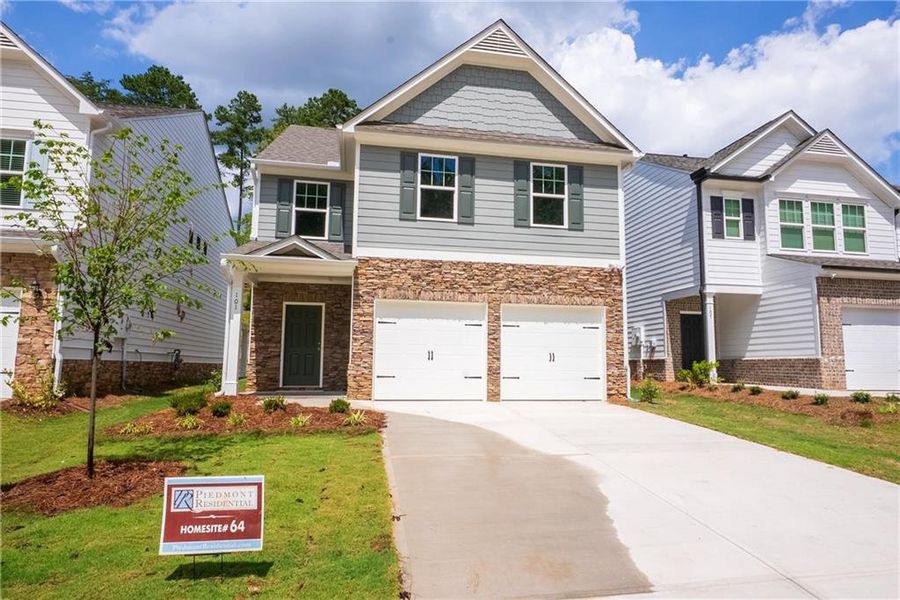 Front exterior of a new home in Castleberry Pointe, Dawsonville, GA, highlighting curb appeal (Image 1).