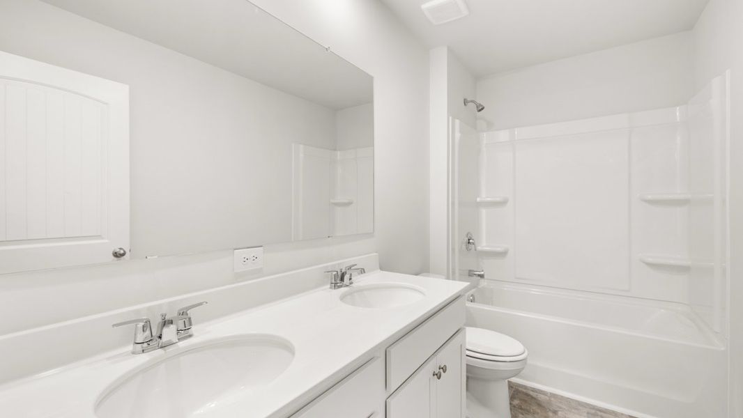 Representative furnished interior of a home built from the Hanover by D.R. Horton in Thompson Ridge, Dallas (Image 9).