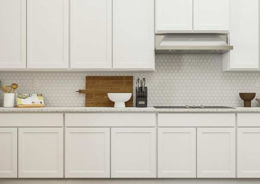 Rendering of spacious kitchen showing
  white cabinetry, a luxury tiled backsplash, glass stovetop and vent, and
  dÃ©cor.