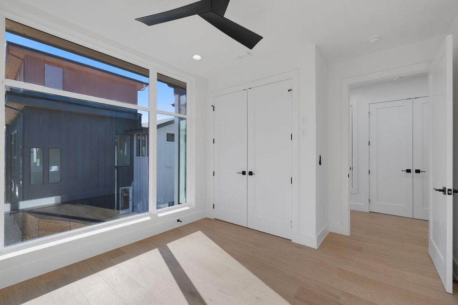 Unfurnished bedroom featuring light wood finished floors, recessed lighting, a closet, and a ceiling fan Unfurnished bedroom featuring light wood finished floors, recessed lighting, a closet, and a ceiling fan