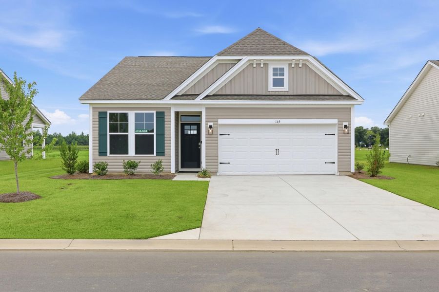 Front exterior of a new home in Edgefield, Loris, SC, highlighting curb appeal (Image 2). Front exterior of a new home in Edgefield, Loris, SC, highlighting curb appeal (Image 2).