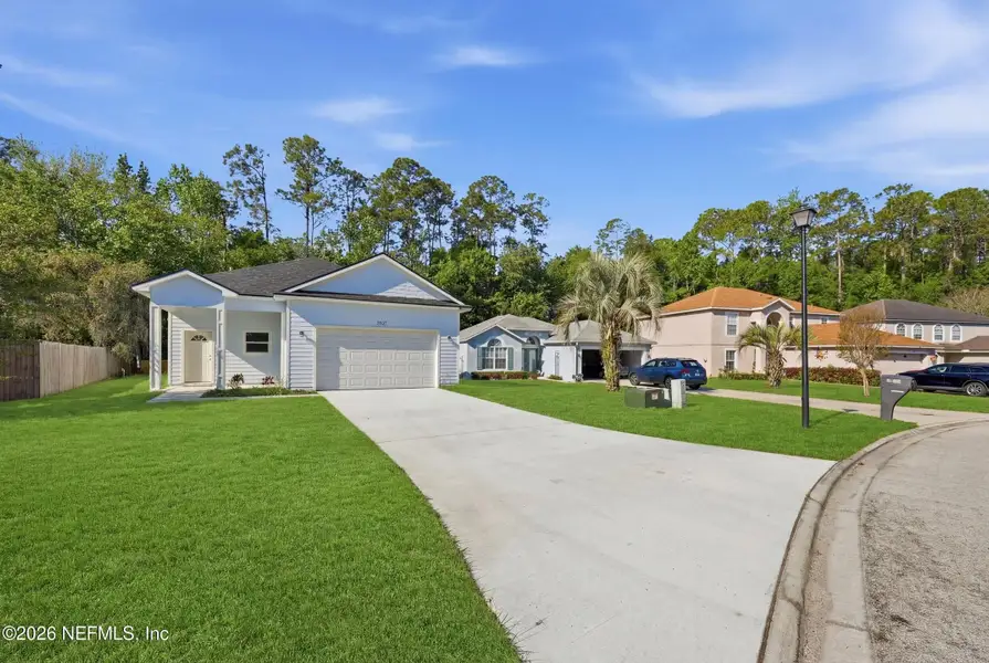 Front exterior of a new home in , Middleburg, FL, highlighting curb appeal (Image 19). Front exterior of a new home in , Middleburg, FL, highlighting curb appeal (Image 19).