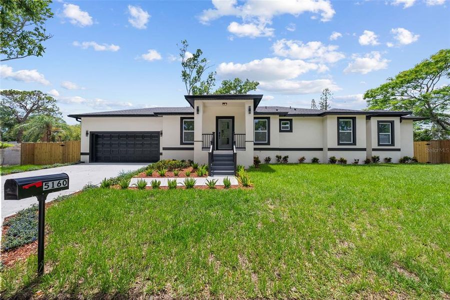 Front exterior of a new home in , St. Petersburg, FL, highlighting curb appeal (Image 24).
